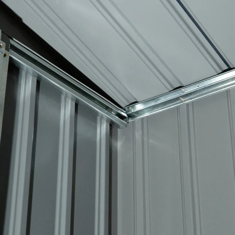 Close-up of the underside of the shed roof panels and the ridge beam