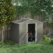 Shed on grass with one sliding door open showing a bike and mower stored inside