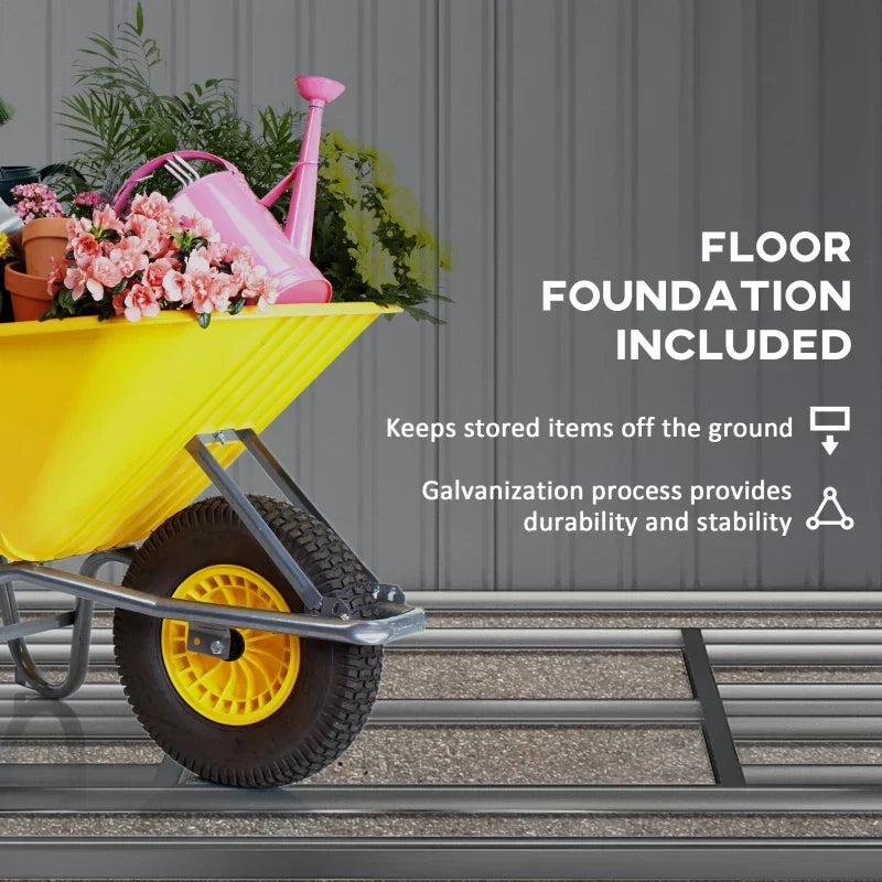 Yellow wheelbarrow of flowers standing on the shed's included floor foundation, which keeps items off the ground