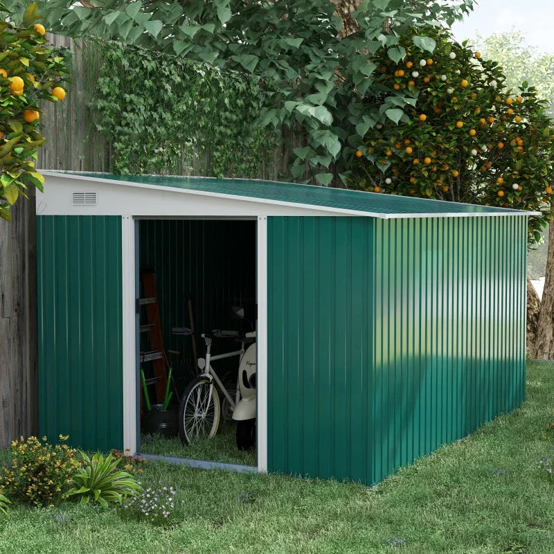Green lean to metal shed under a fruit tree with the sliding door open and a bike, ladder and tools stored inside