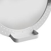 Close-up of the pegboard frame and storage tray at the base of the oval mirror