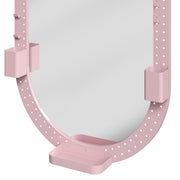 Close-up of the pegboard frame with pen holders and storage tray on the oval mirror