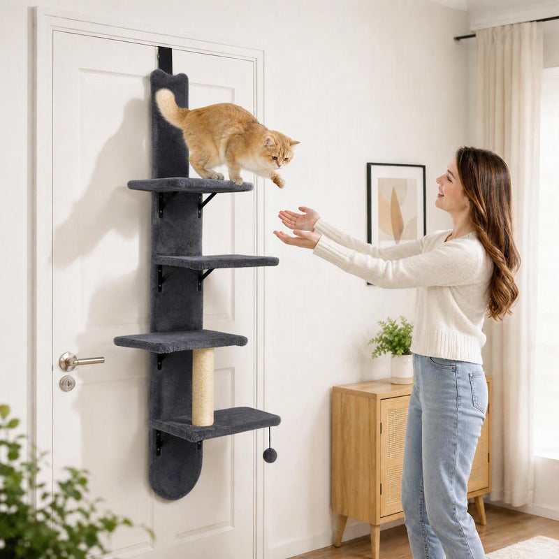 Woman reaching toward a cat on the door-hung cat shelf
