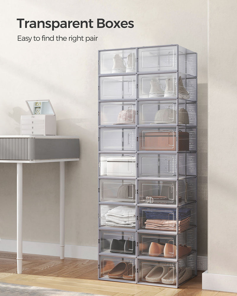 Tall stack of transparent Songmics shoe boxes with visible shoes inside a bedroom