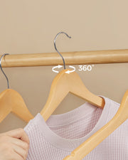 Close-up of the metal hook rotating 360 degrees on the wooden hanger