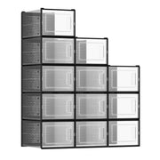 12 stackable clear shoe storage boxes with black frames arranged in a stepped tower, studio shot