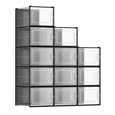 12 stackable clear shoe storage boxes with black frames arranged in a stepped tower, studio shot