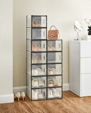 Close-up of a shoe stored inside a clear stackable storage box with front door open