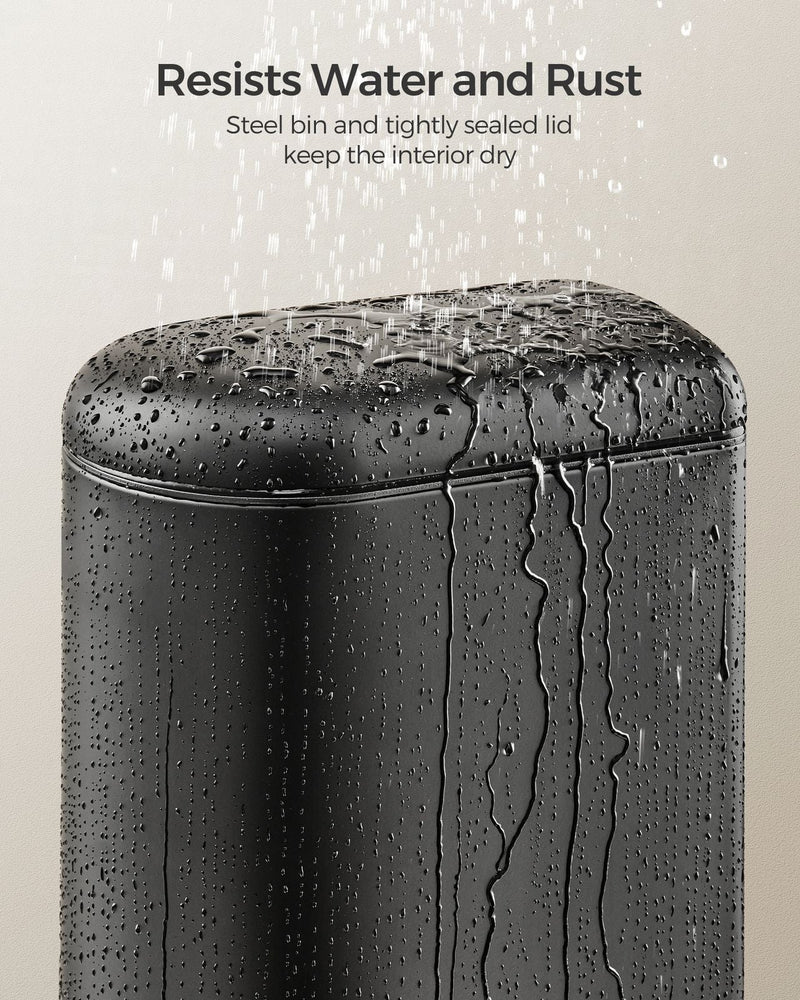 Close-up of water beading on the rust-resistant steel lid of the Songmics pedal bin