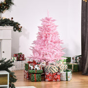 4ft pink Christmas tree in a living room beside a white picket fence and wrapped gifts