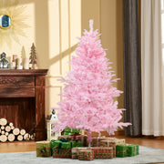 5ft pink Christmas tree beside a fireplace and log store with gifts at the base