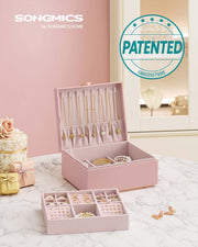 Jewellery box open showing the top tray with earring and ring sections