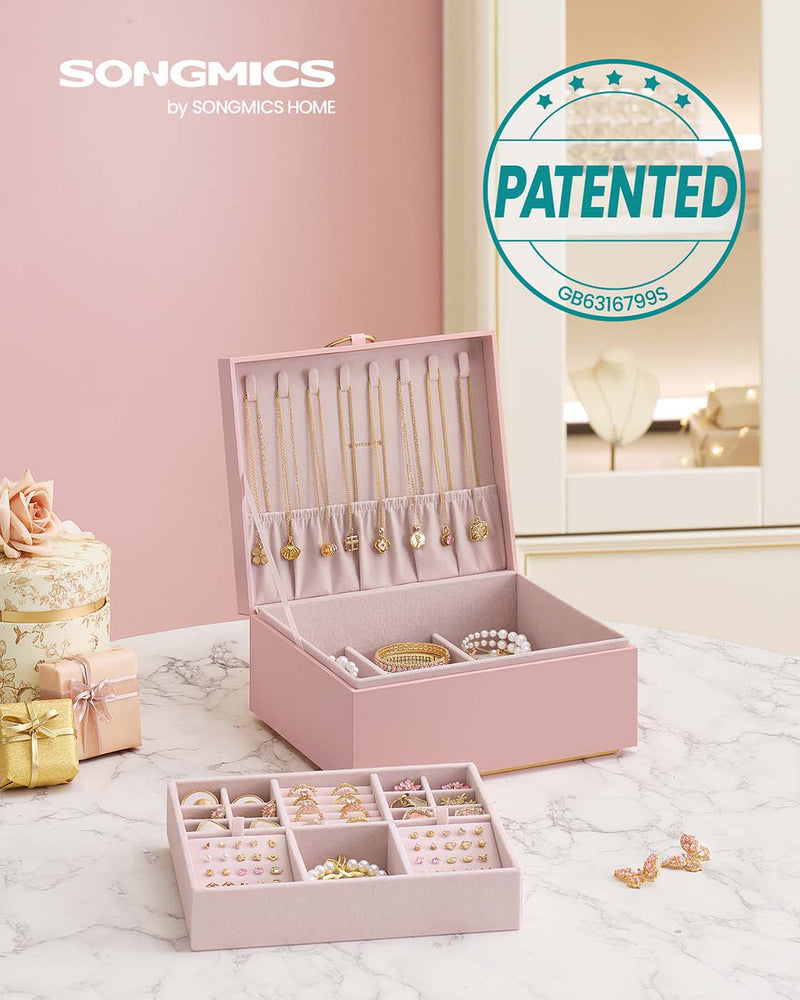 Jewellery box open showing the top tray with earring and ring sections
