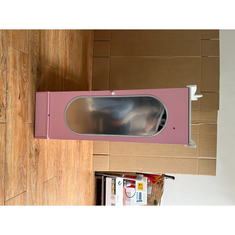 Pink kids wardrobe with the mirrored door open, shown before packing