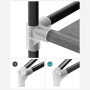 Close-up of a white plastic connector joining two steel frame tubes