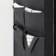 Close-up of the 4 side pockets holding rolled towels and a belt