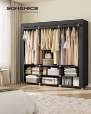 Wide black portable wardrobe styled in a bedroom beside a bed and curtains