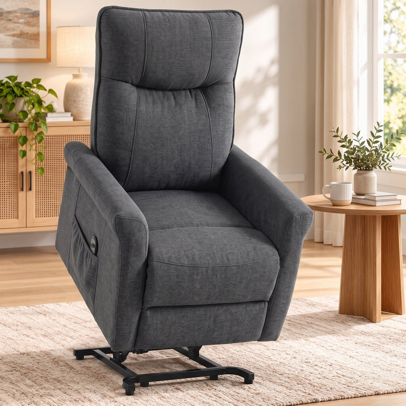Dark grey power lift recliner in the raised position beside a wooden side table