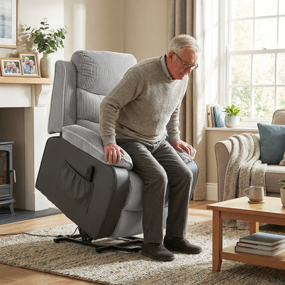 Elderly man using the power lift chair to rise from a seated position in a living room