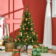 4ft decorated Christmas tree with gifts beside a red panelled wall