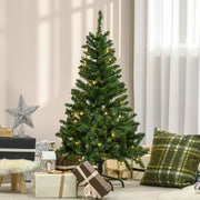 Pre-lit Christmas tree in a bright living room with a star topper and wrapped gifts