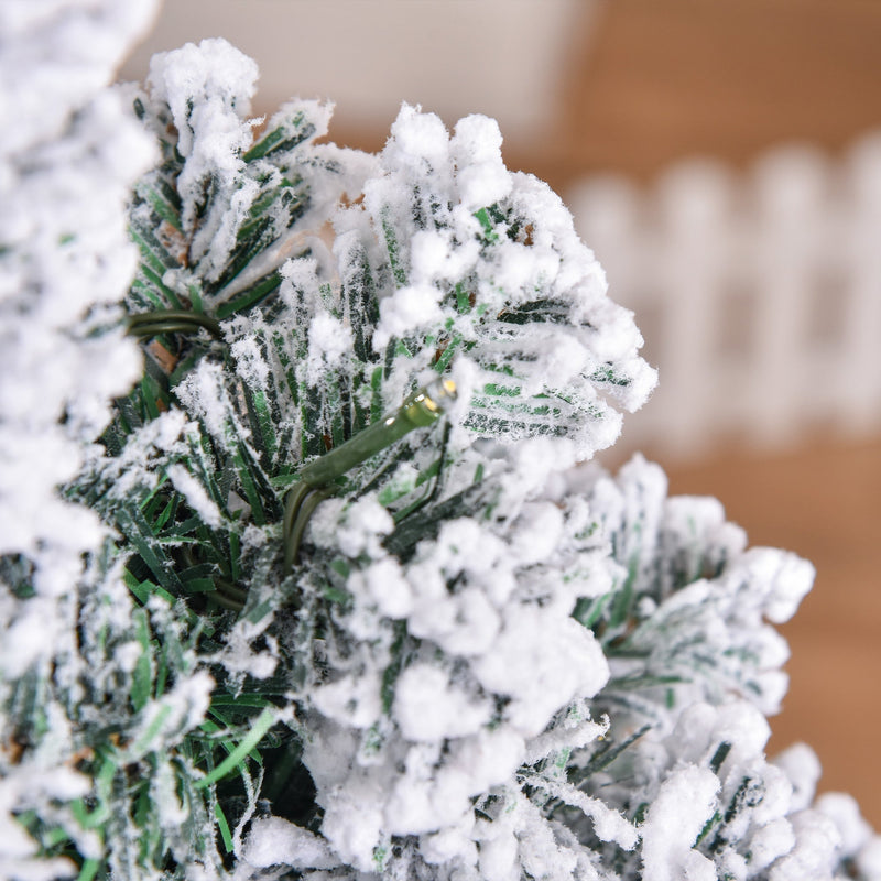 Close-up of snow-covered branch tips on the 4ft tree