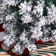 Close-up of frosted branches above wrapped gifts on the 4ft tree