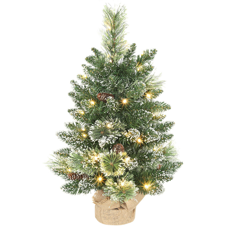 Snow-flocked 60 cm tabletop Christmas tree with warm white LEDs and a linen-look base on white
