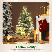 Festive Beauty scene with a glowing mini tree, candles and pine cones on a table