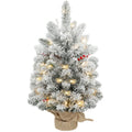 Slim snow-flocked 60 cm tabletop Christmas tree with red berries, lights and a linen-look base on white