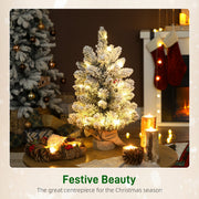 Festive Beauty scene with a glowing slim flocked mini tree on a decorated table