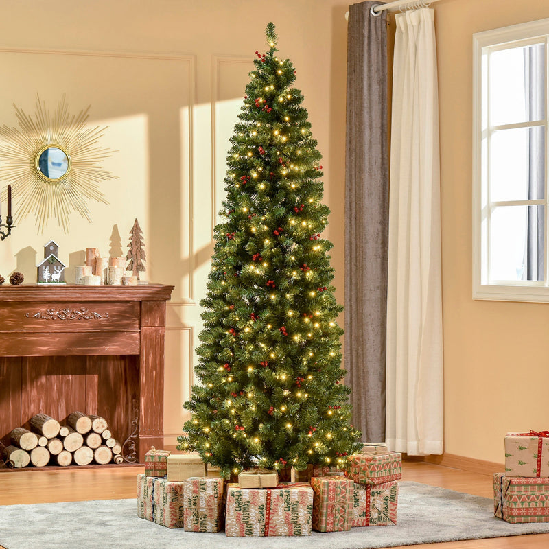 7ft pencil Christmas tree lit up in a bright living room with wrapped gifts