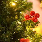 Close-up of a cluster of red berries and warm white LED lights on the 5ft tree