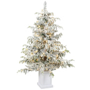4ft snow flocked Christmas tree with warm white lights in a white pedestal pot on a white background
