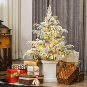 3ft flocked Christmas tree with warm white lights surrounded by gifts