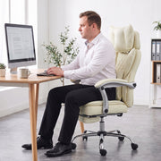 Person typing at a desk while seated upright in the beige office chair