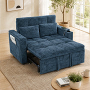 Dark blue tufted sofa bed with two pillows and the bed extended in a bright living room