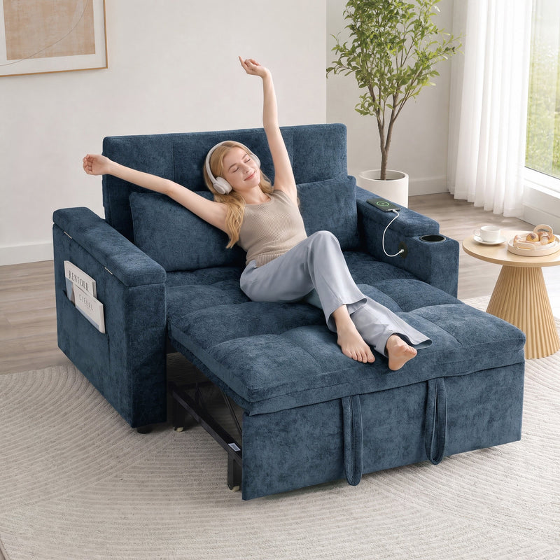 Woman relaxing on the dark blue sofa bed in recliner mode with her phone charging by USB cable