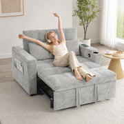 Woman stretching out on the grey sofa bed in recliner mode while listening to music
