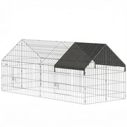 Black and silver metal rabbit run with a shade cover over one end, on a plain background