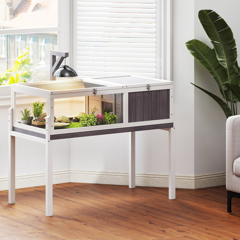 Raised tortoise cage styled in a room setting