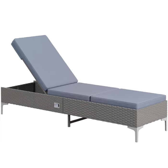 Image of a reclining rattan sun lounger with dark grey cushion 