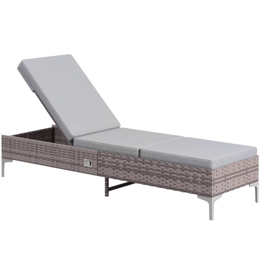 Image of a reclining rattan sun lounger with a light grey cushion 