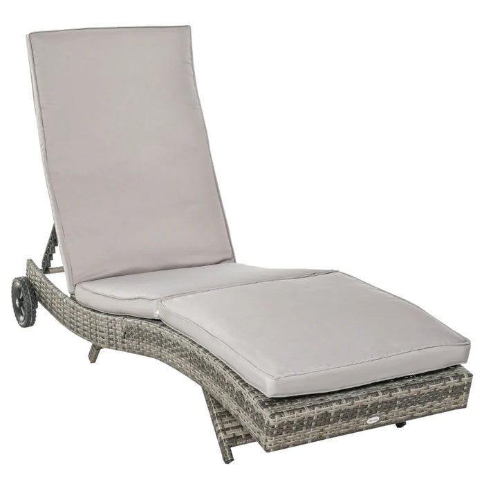 Image of an ergonomic curved rattan sun lounger with cushion and wheels 