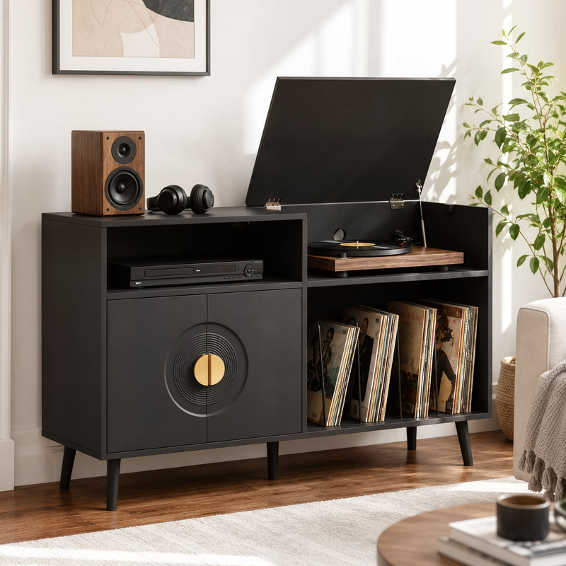 Black record player stand in a living room with turntable, speaker and headphones on top