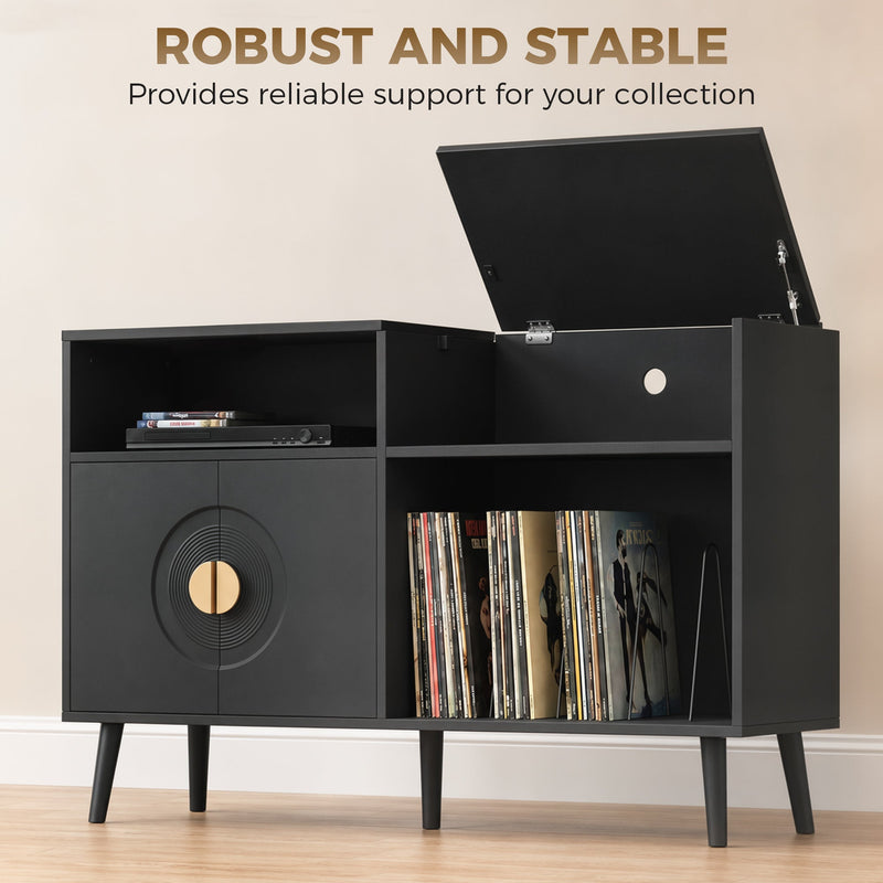 Close-up of black record player stand lid open showing vinyl records stored inside
