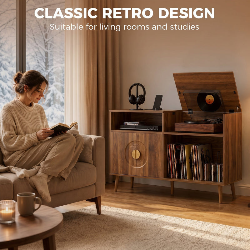 Woman reading in an armchair beside a walnut record player stand in a living room