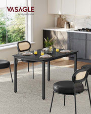 Studio shot of the empty dining table showing the steel frame legs
