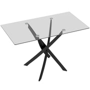 Rectangular glass dining table with black steel cross legs on a plain background