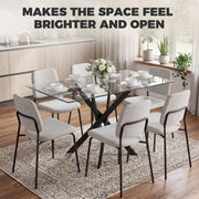 Clear glass table with grey chairs in a bright kitchen, labelled makes the space feel brighter